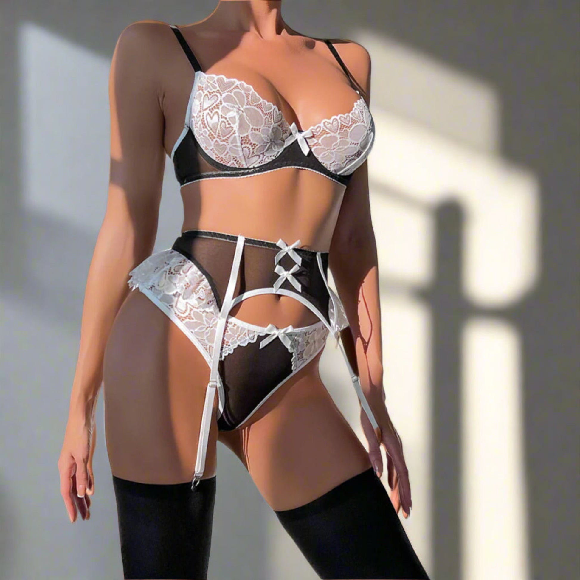 Lace lingerie set with black and white details on a neutral background