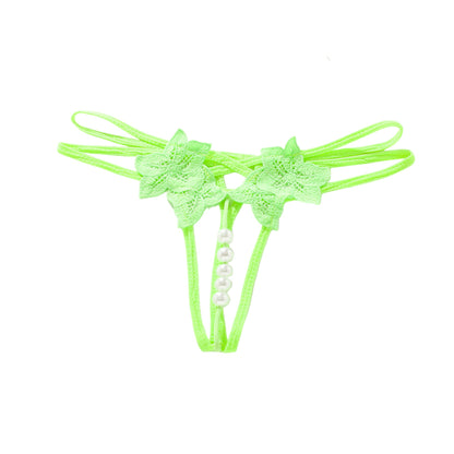 Neon green lace thong with floral designs on a white background