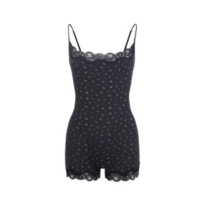 Black lace-trimmed romper on a white background